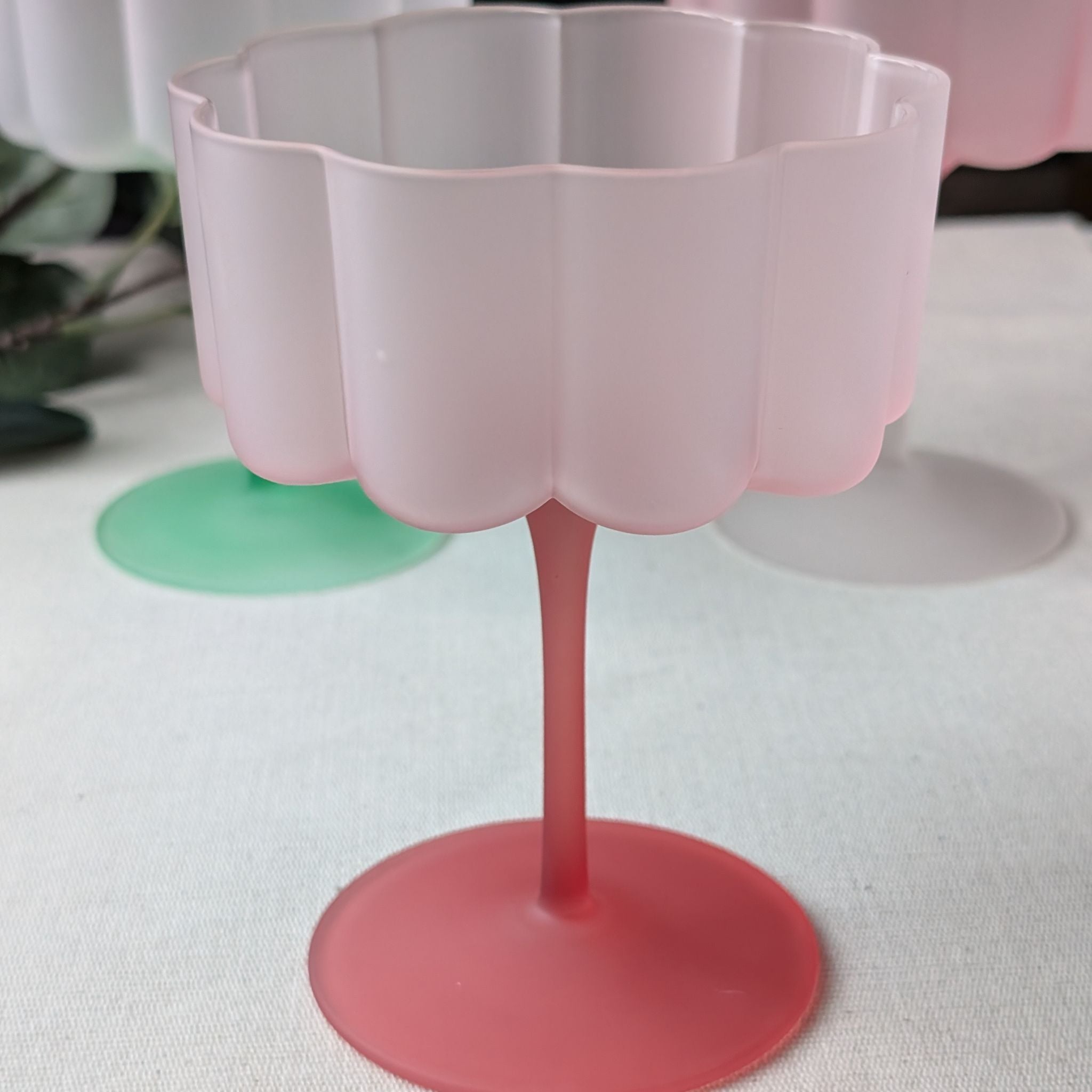 Pink pastel flower-shaped scalloped glass, perfect for cocktails, wine, or desserts