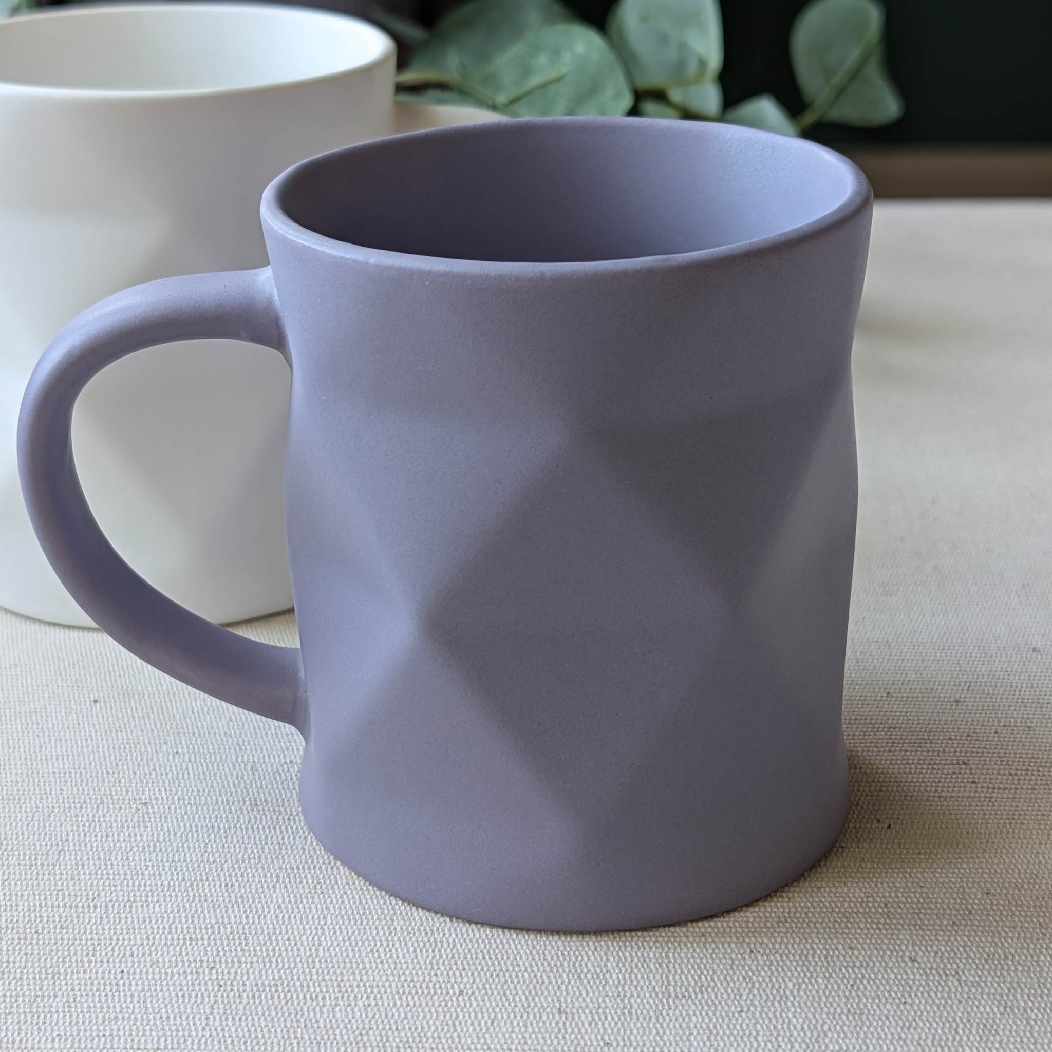 Modern geometric ceramic mug in matte purple