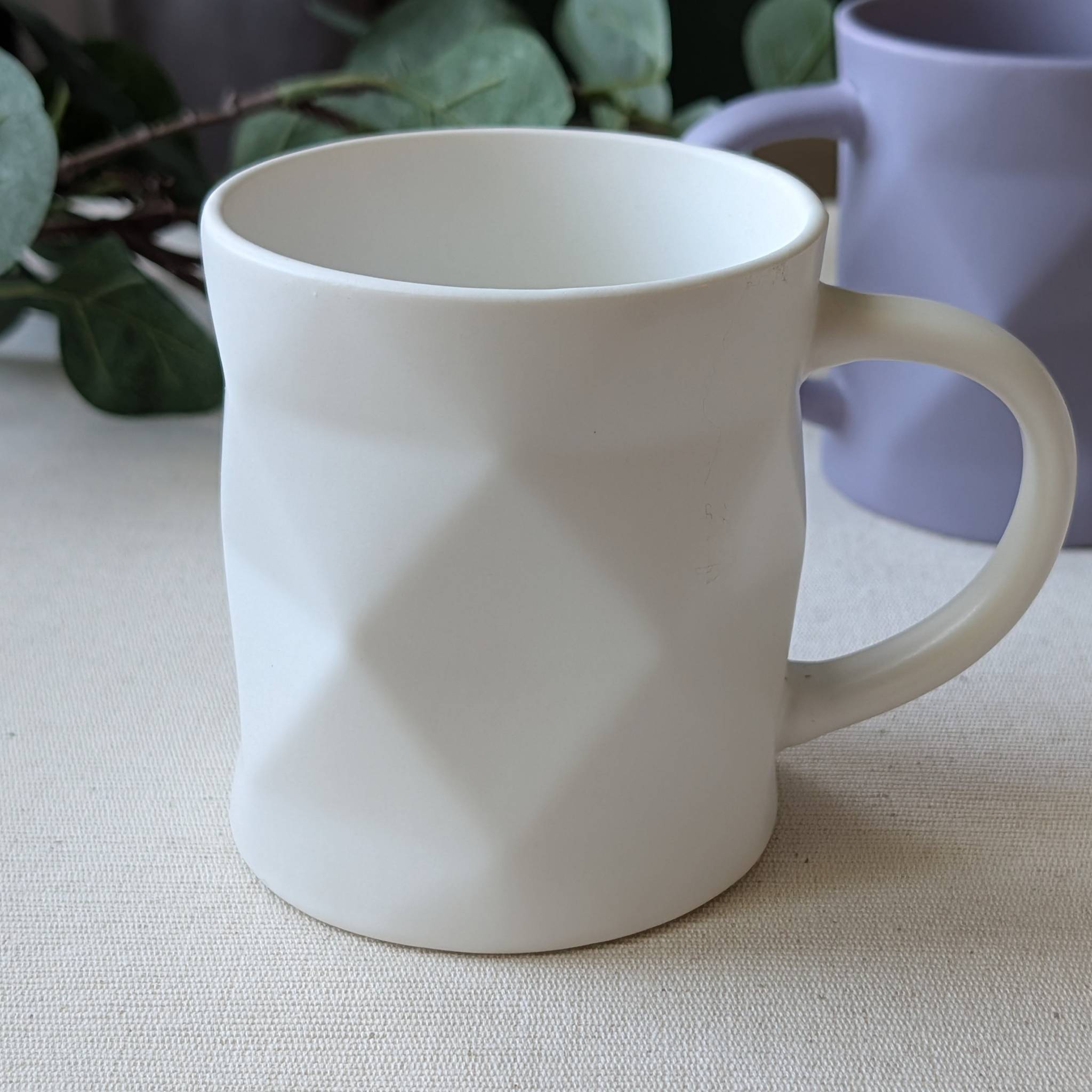 Modern geometric ceramic mug in matte white