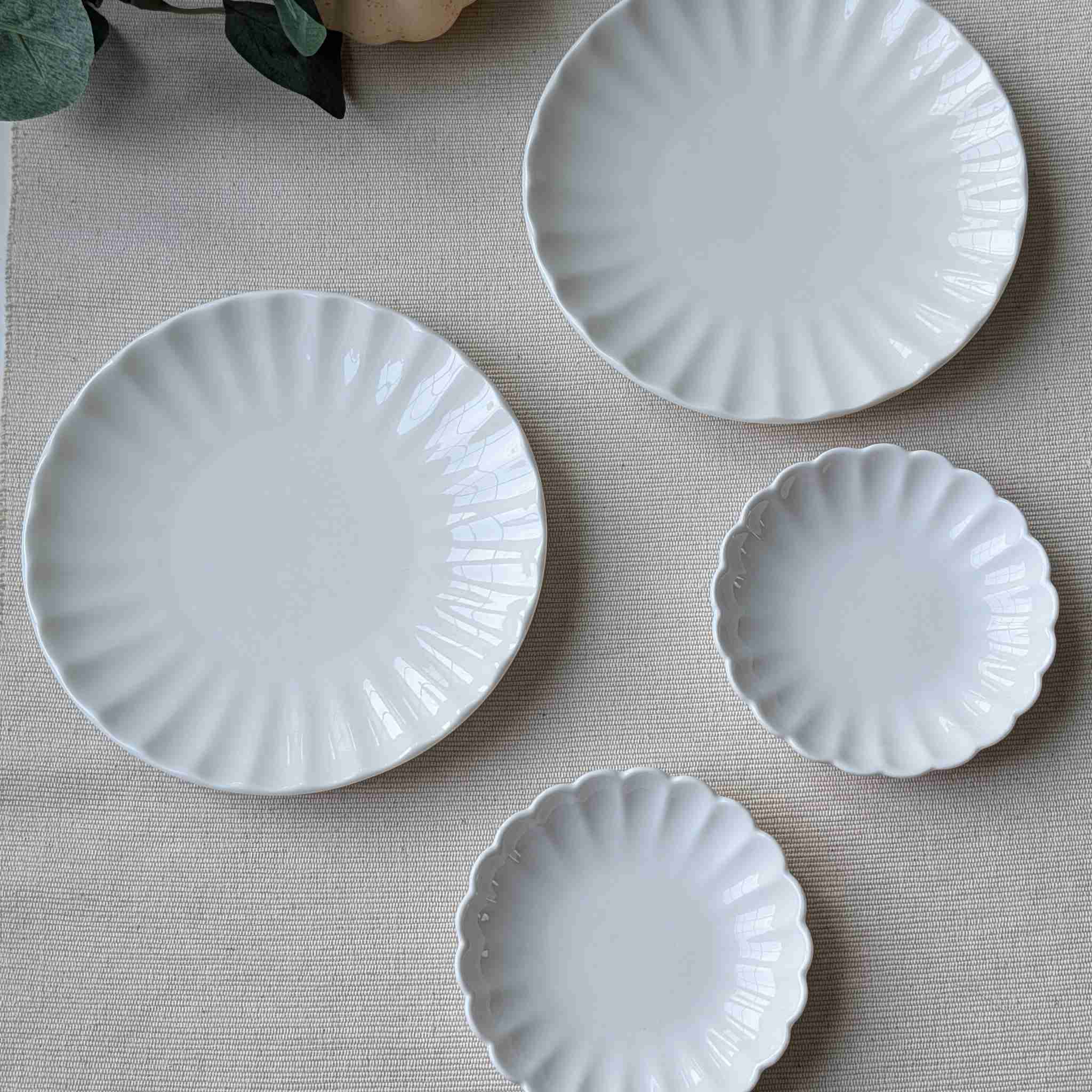 Set of ivory scalloped ceramic plates for dessert and appetizer