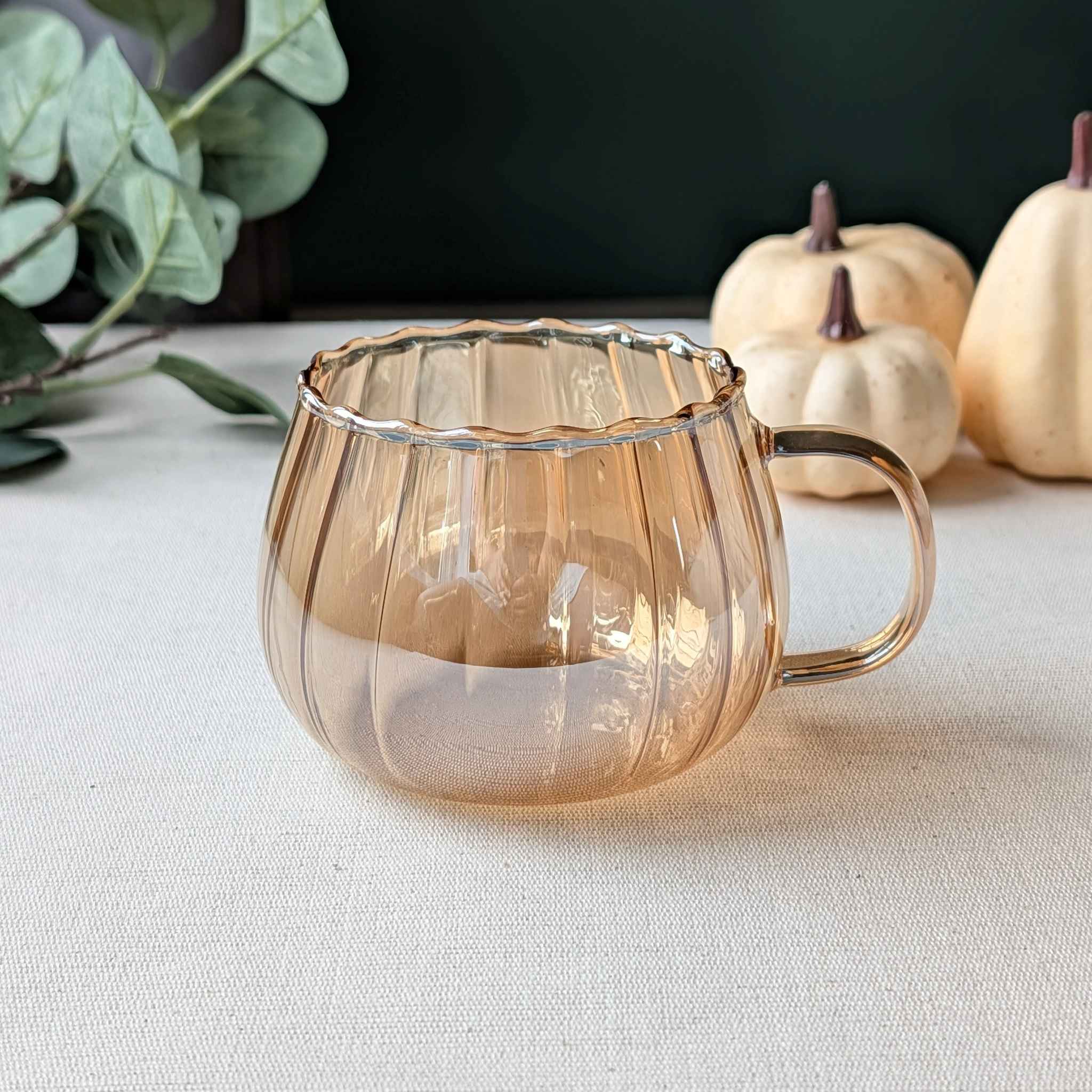 Lightweight amber pumpkin-shaped glass mug