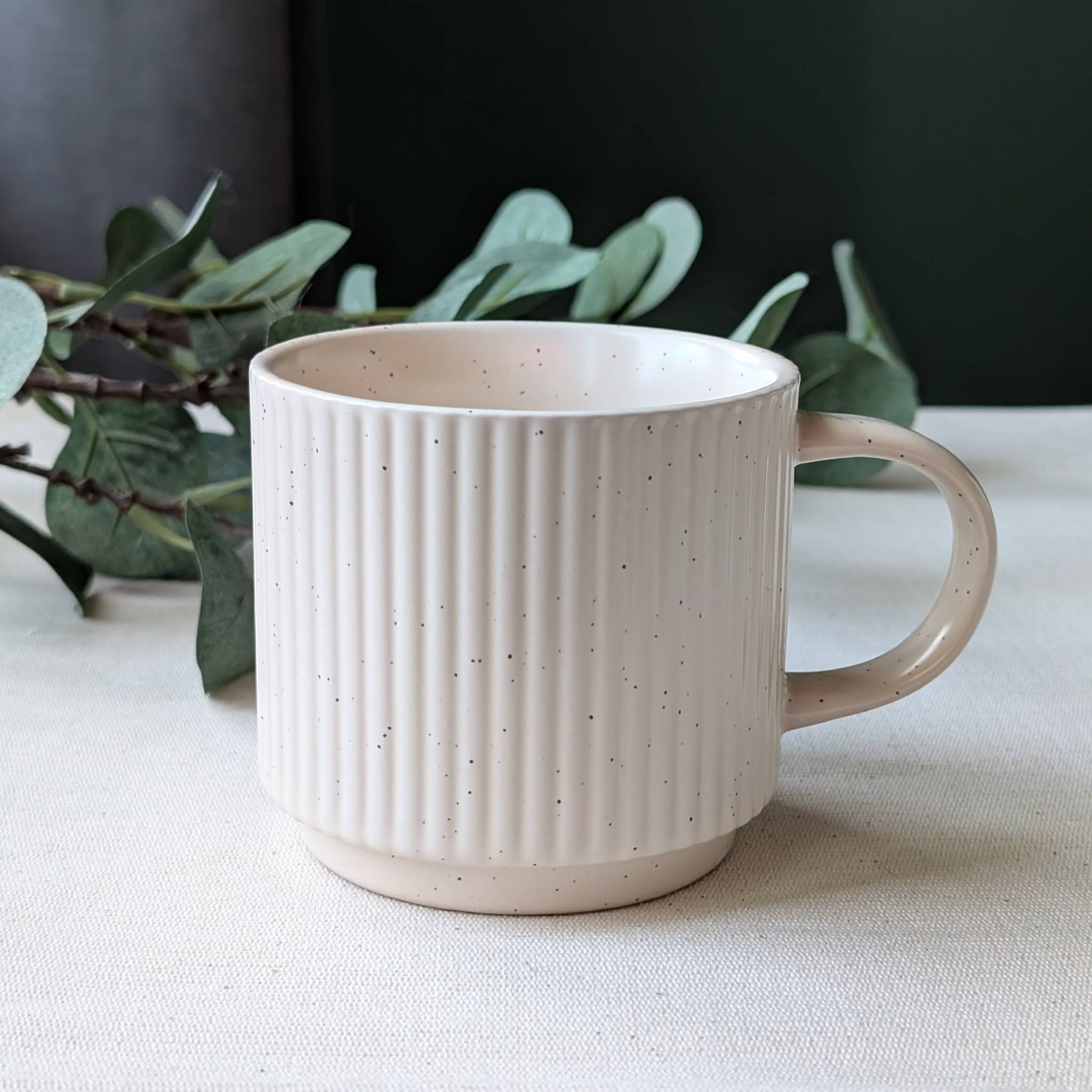 Minimalist cream speckled ceramic mug with modern handmade design