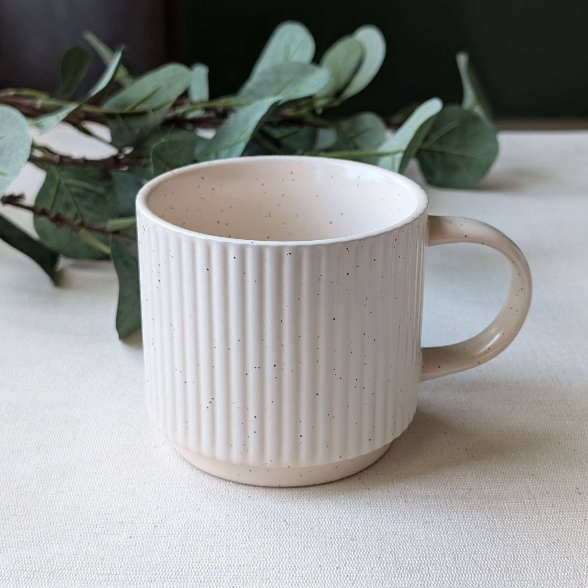 Minimalist cream speckled ceramic mug with modern handmade design