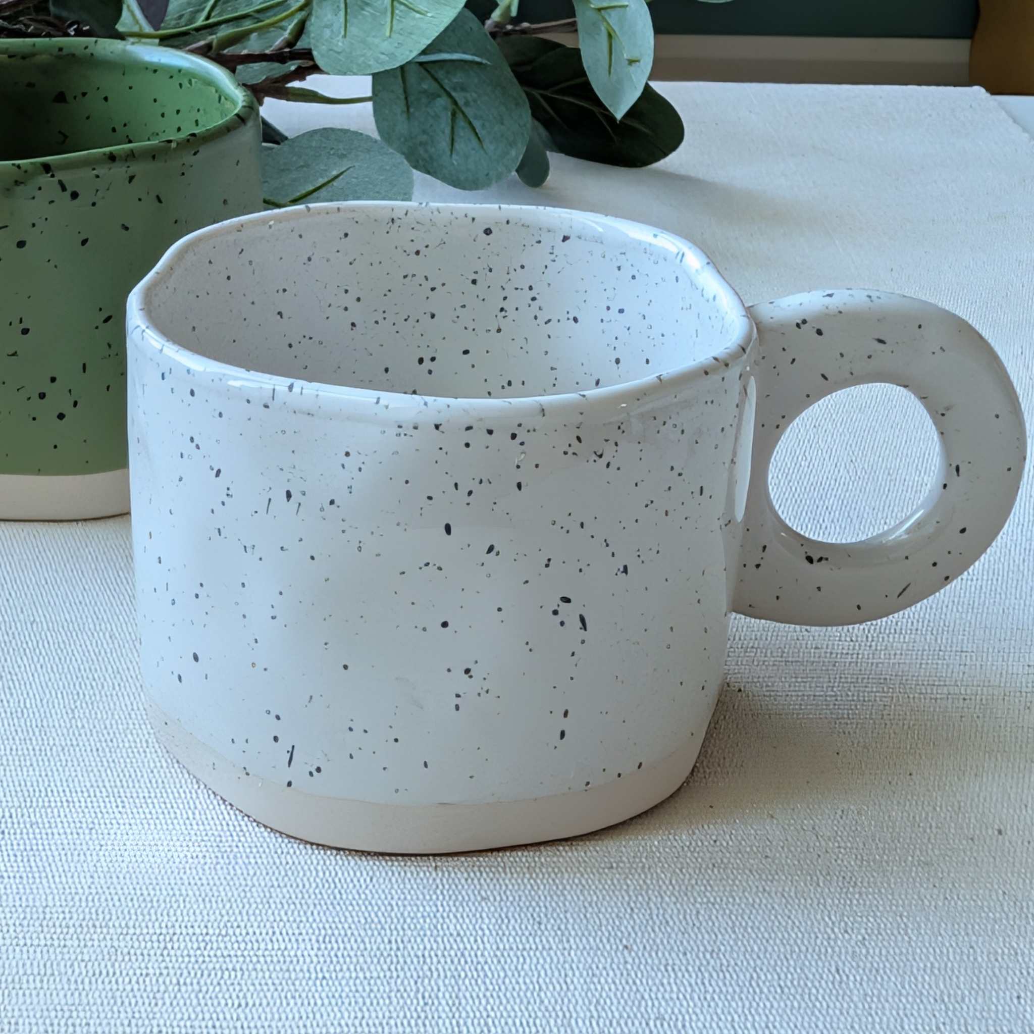 White speckled ceramic mug