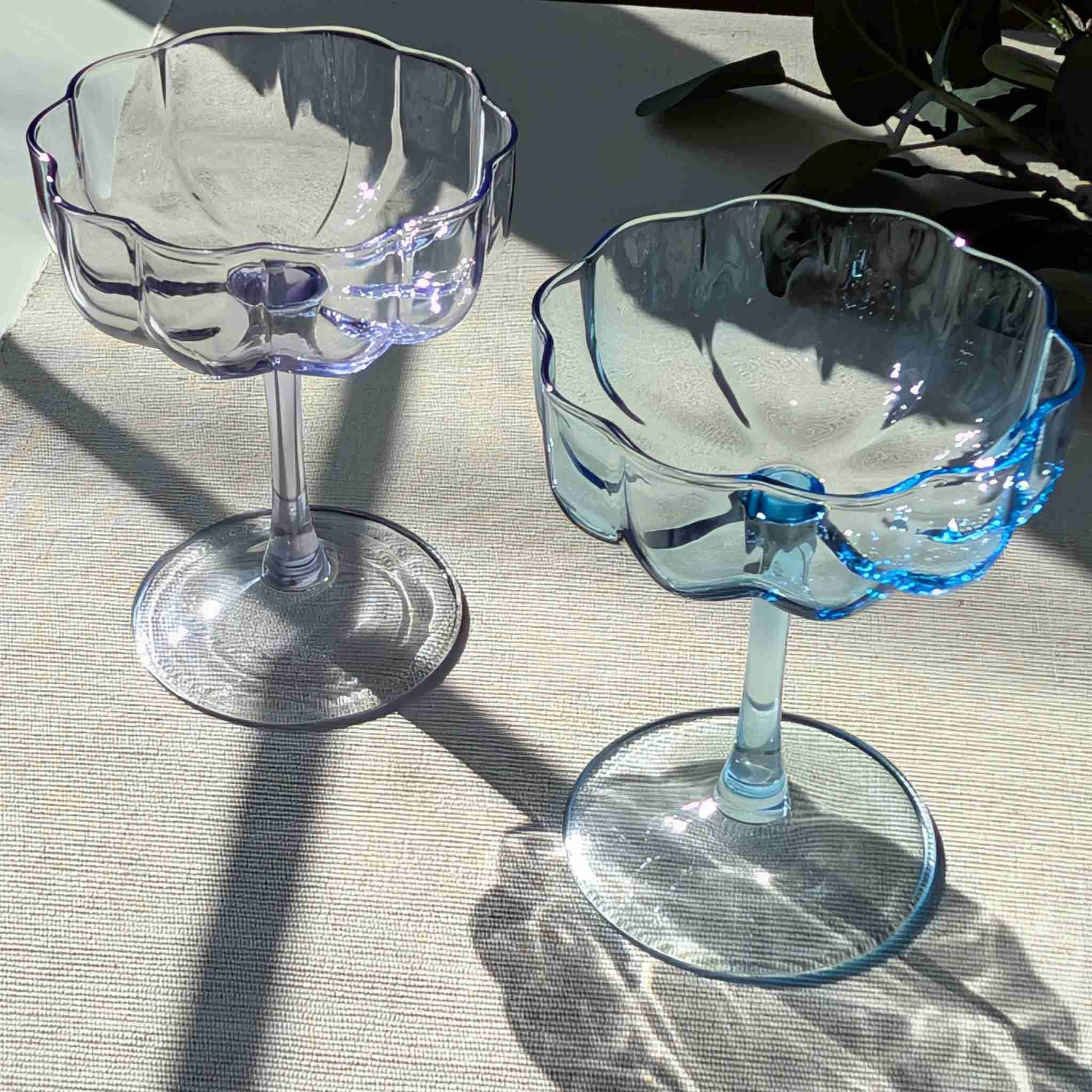 Set of vintage-inspired scalloped glass coupes in blue and purple