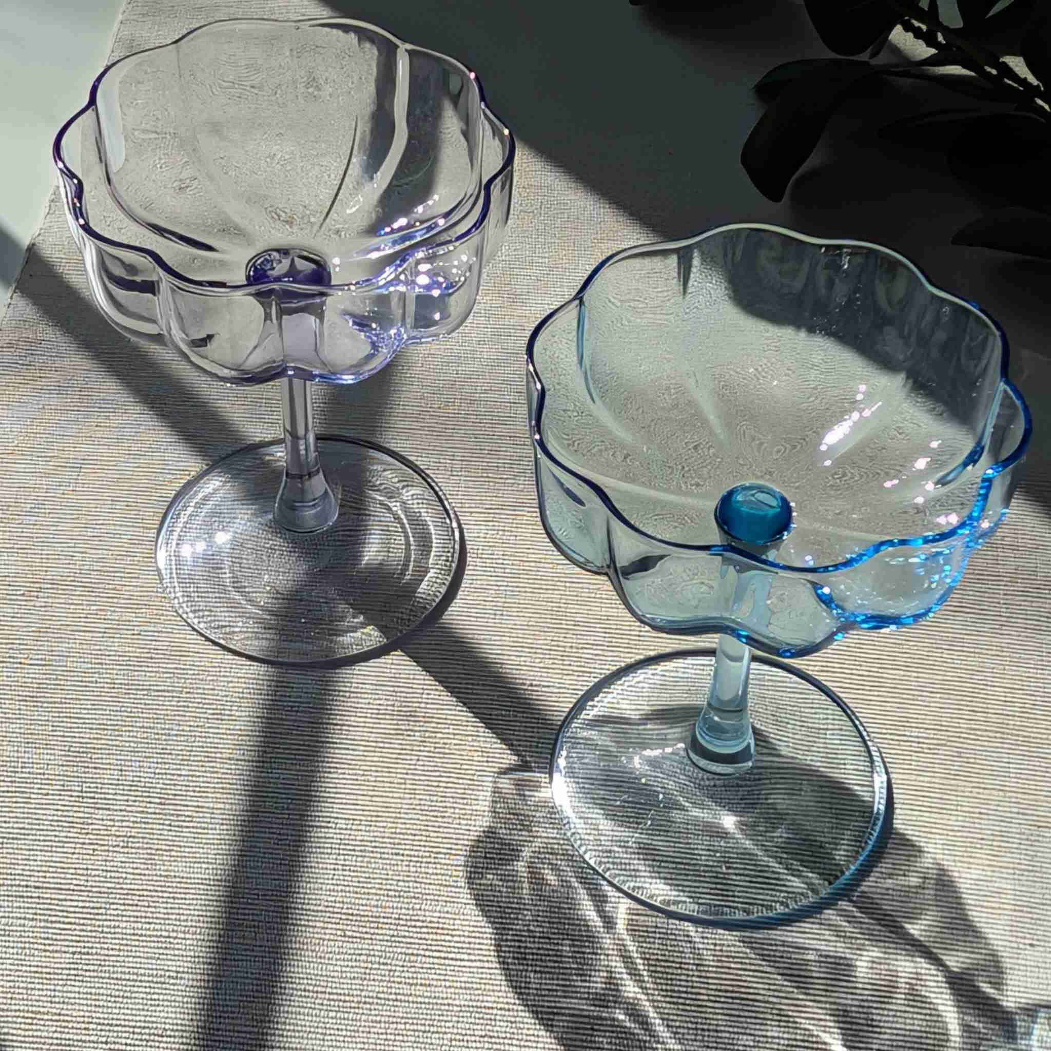 Set of vintage-inspired scalloped glass coupes in blue and purple