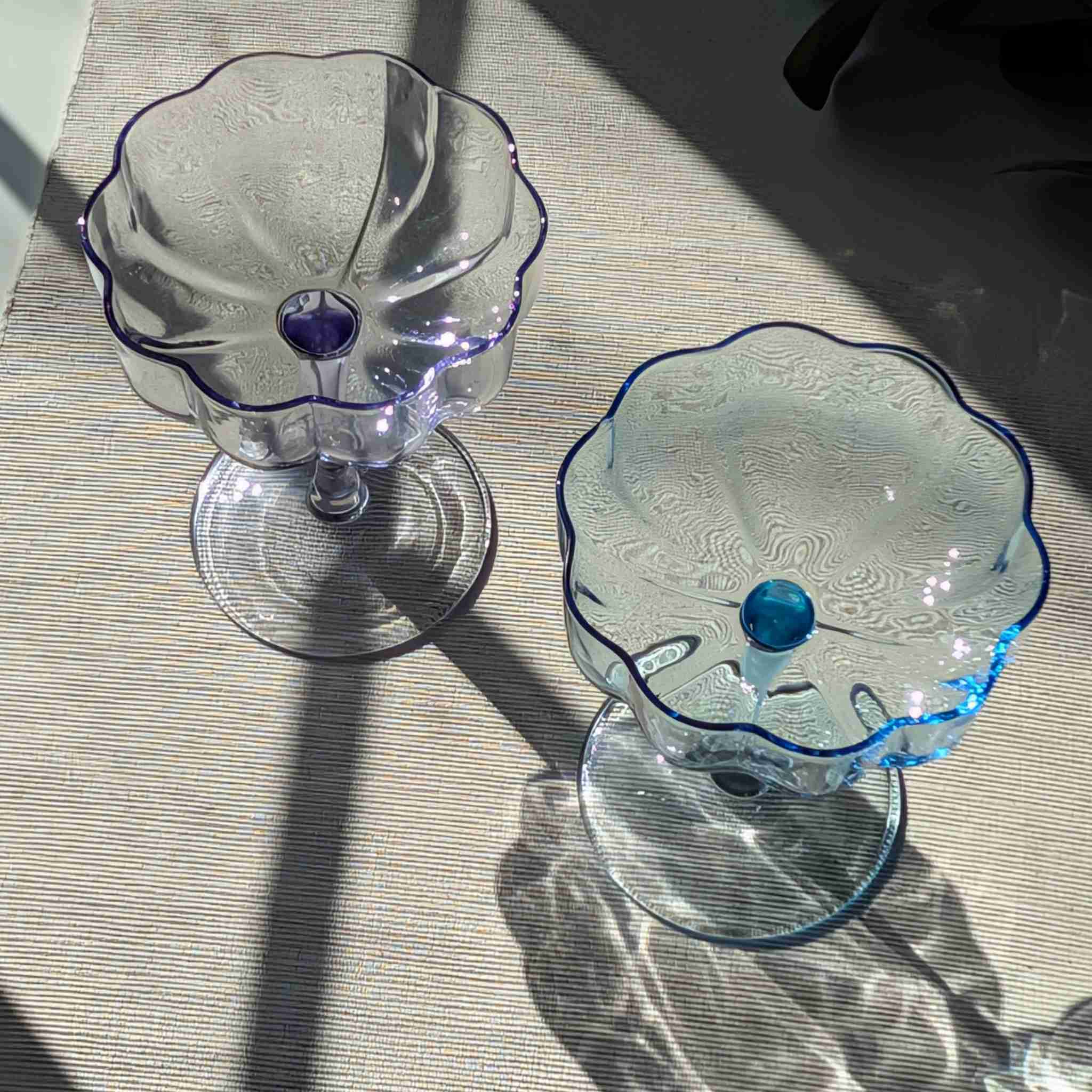 Set of vintage-inspired scalloped glass coupes in blue and purple