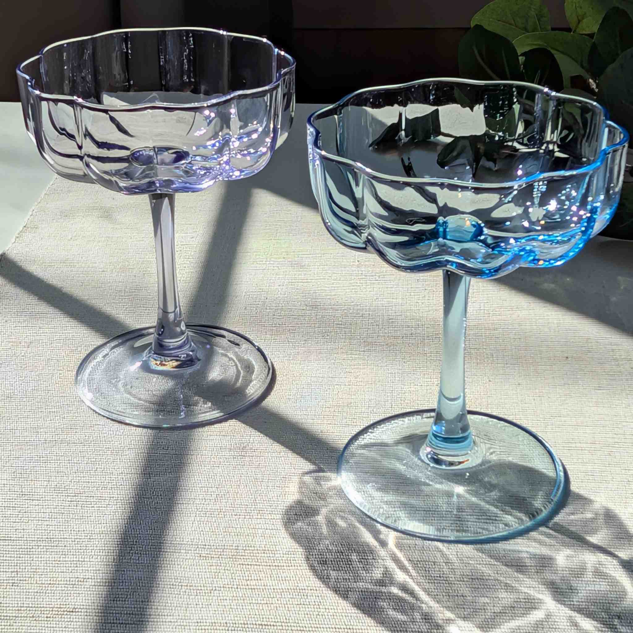 Set of vintage-inspired scalloped glass coupes in blue and purple