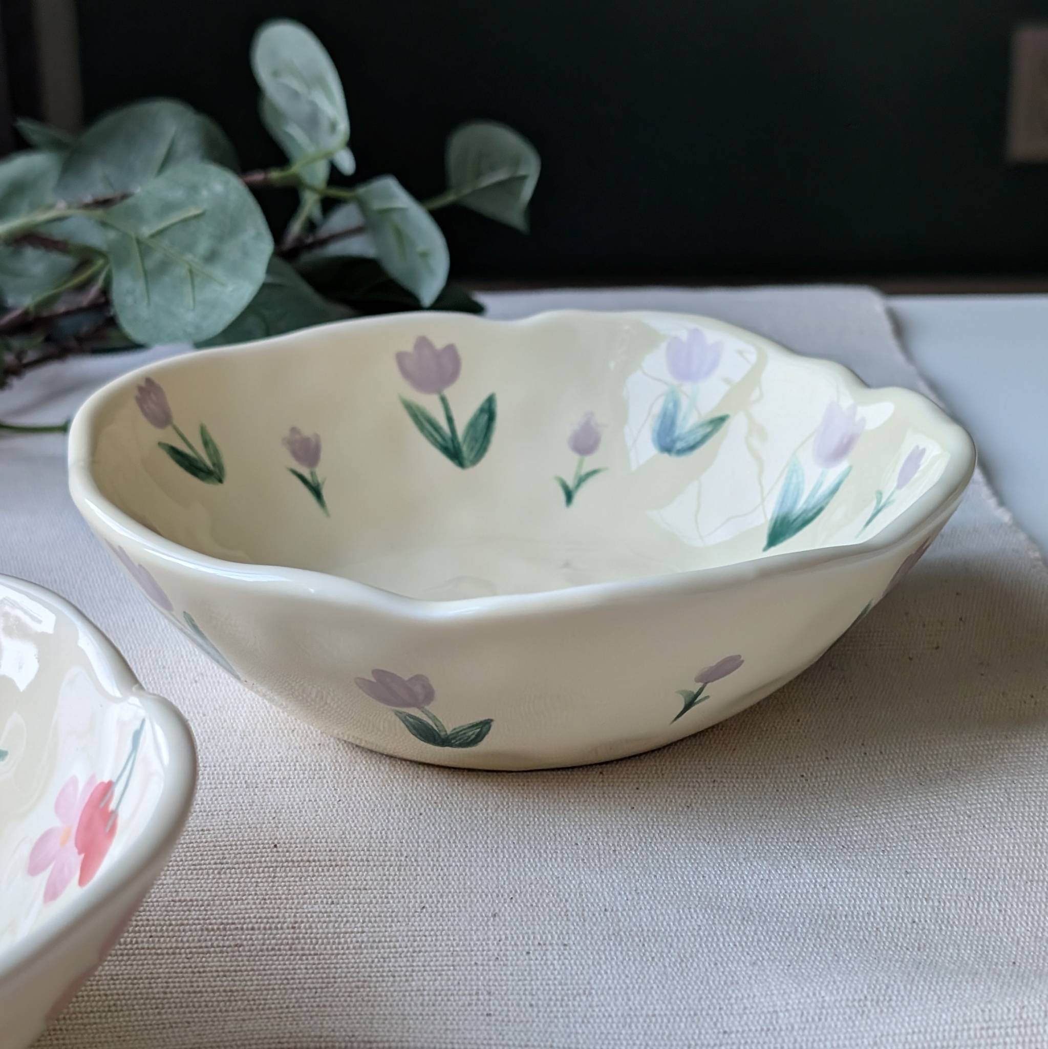 Yellow wavy ceramic bowl with lavender tulips design